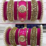 CLASSY GOLD TONE STONE AND PEARL VELVET TOUCH MAGENTA BANGLE SET